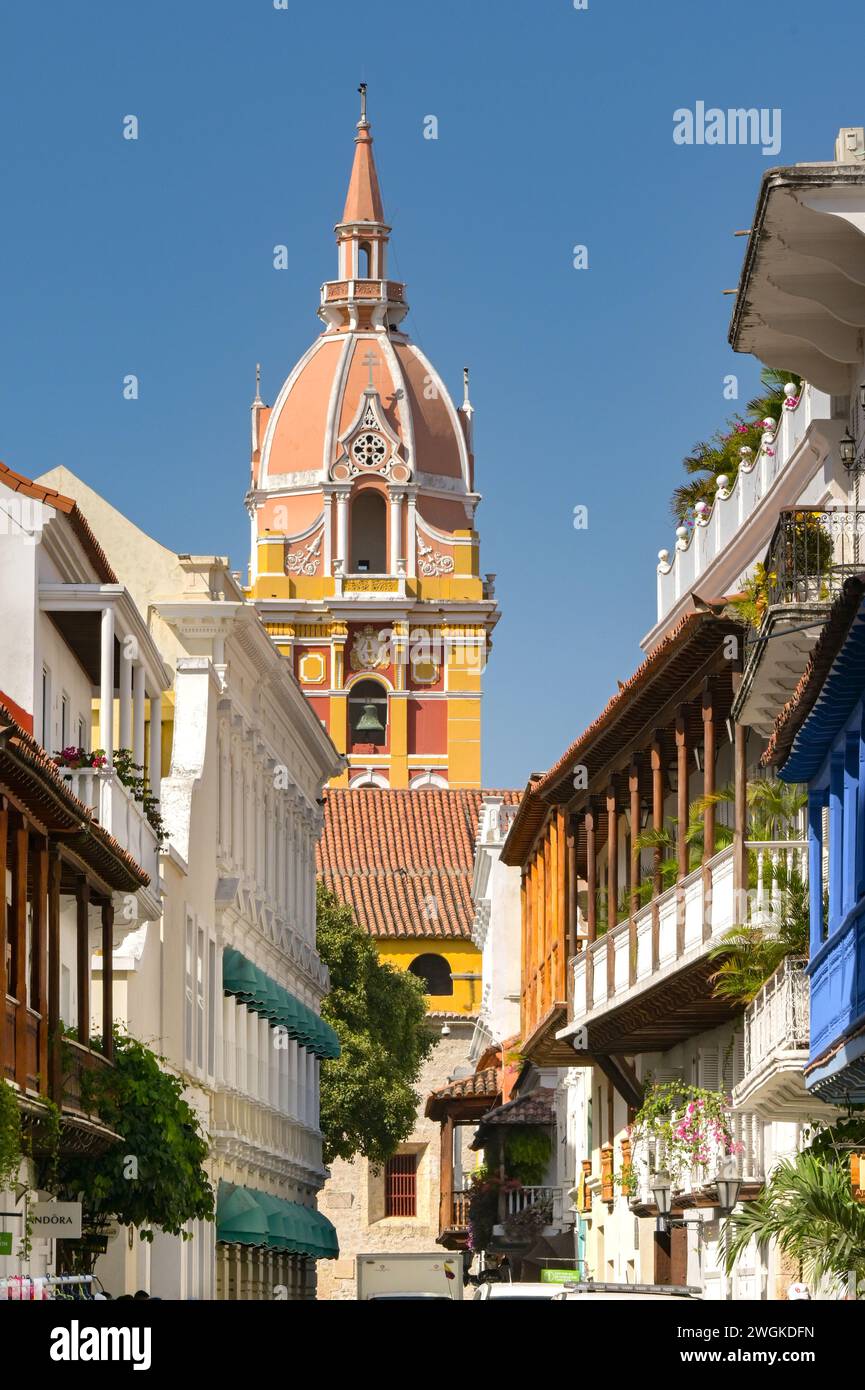 Cartagena, Colombia - 24 January 2024: Narrow street of buildings with balconies in the historic old town of Cartagena. Stock Photo