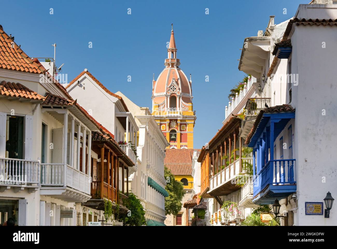 Cartagena, Colombia - 24 January 2024: Narrow street of buildings with balconies in the historic old town of Cartagena. Stock Photo