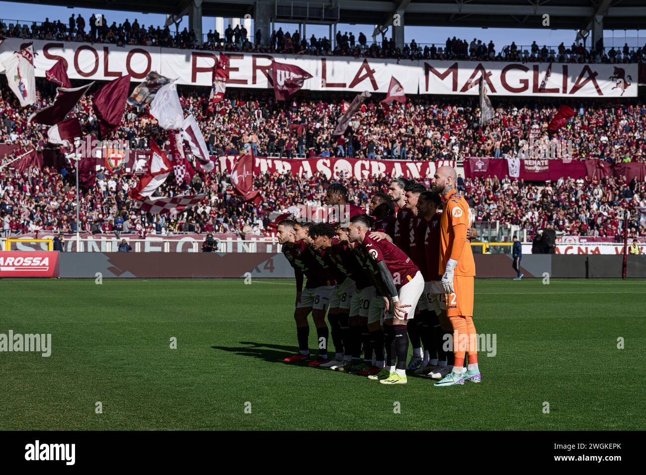 Turin, Italy. 4 February 2024. Players of Torino FC pose for a team photo in front of sector 'Curva Maratona' prior to the Serie A football match between Torino FC and US Salernitana. Nicolò Campo/Alamy Live News Stock Photo