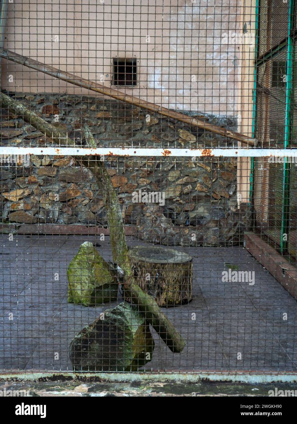 Outdoor fence at the zoo. Empty cages in the zoo. Winter at the zoo