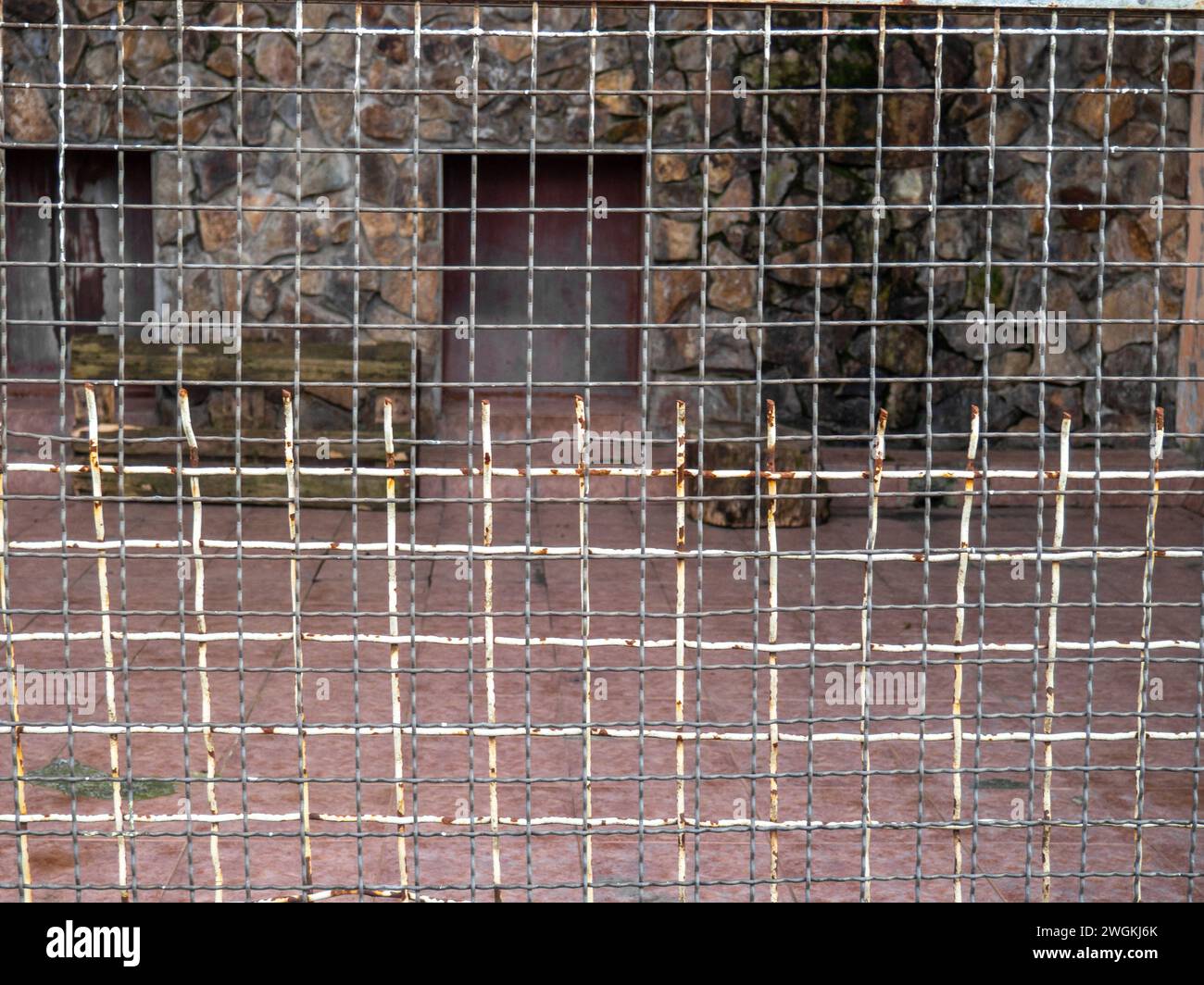 Outdoor fence at the zoo. Empty cages in the zoo. Winter at the zoo