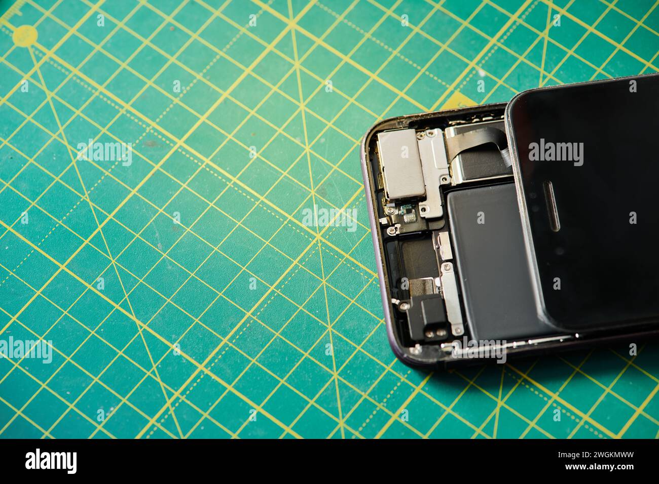 top view of mobile phone on table in professional repair shop, electronics maintenance service Stock Photo