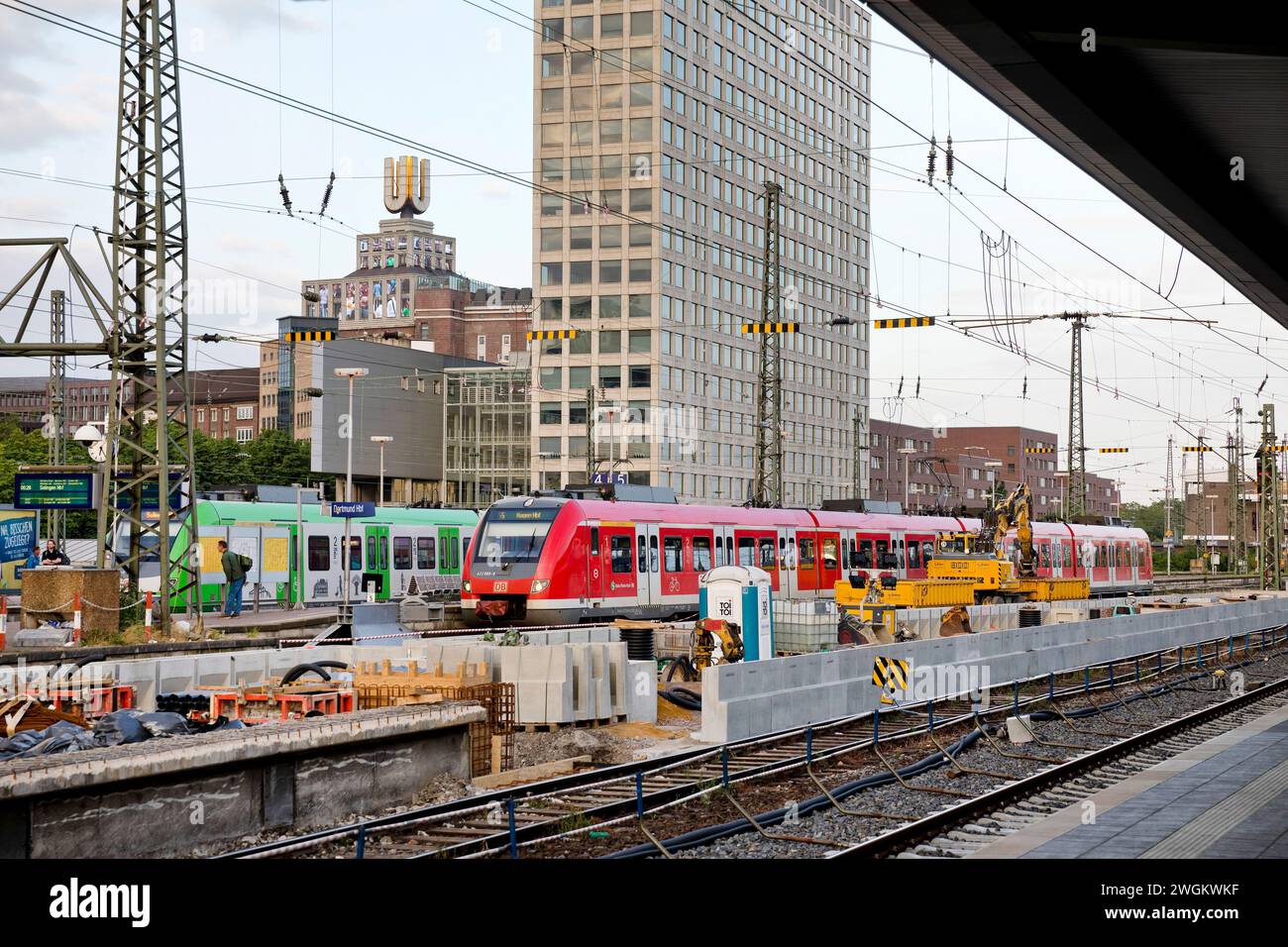 construction site and local trains at Dortmund Central Station, Dortmund U-tower and the Harenberg City Centre in the background, Germany, North Rhine Stock Photo