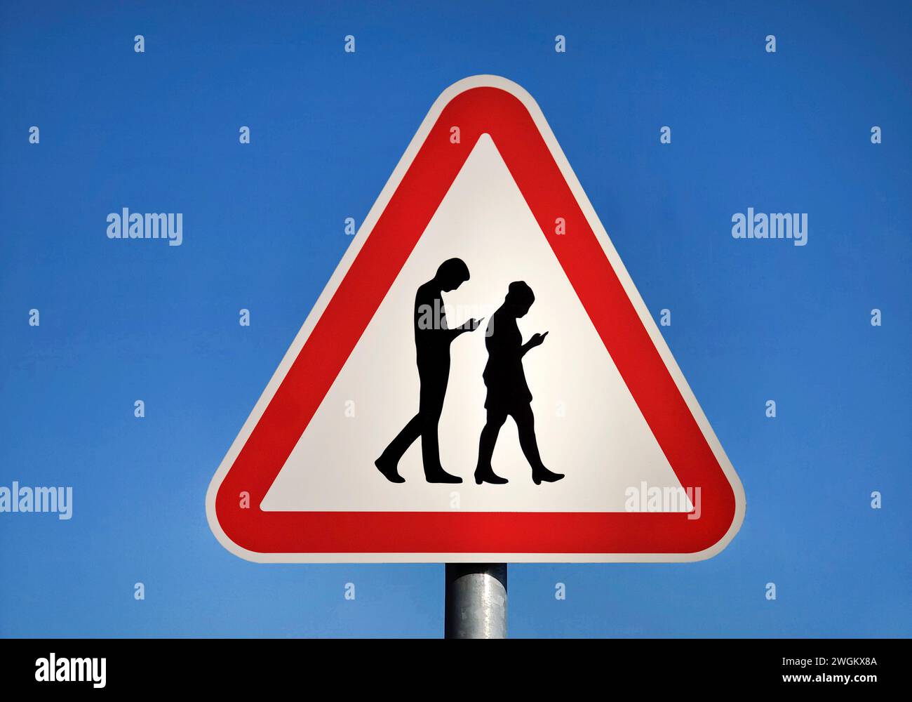 Fictitious traffic sign Danger from cell phone users, photomontage Stock Photo