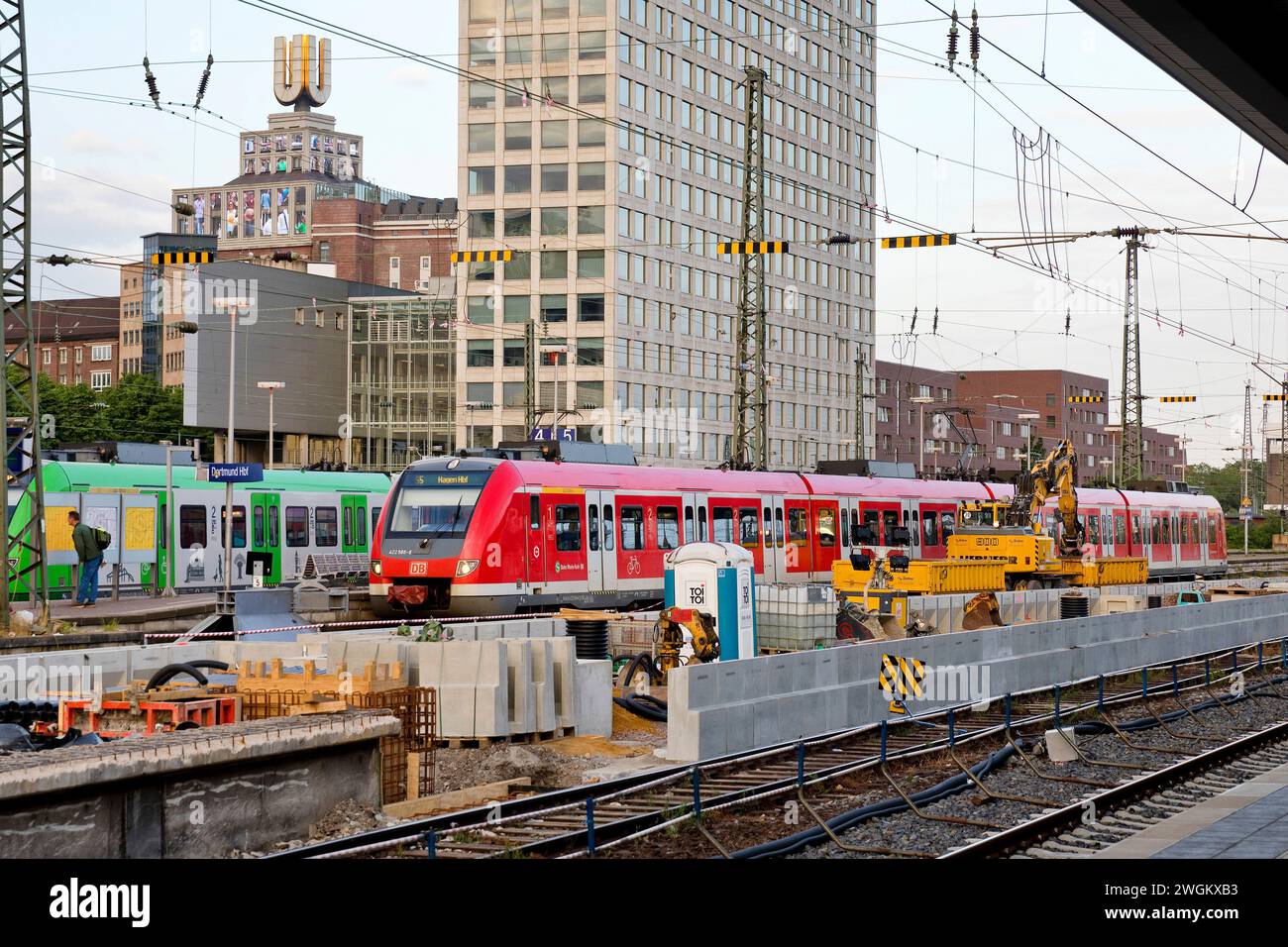 construction site and local trains at Dortmund Central Station, Dortmund U-tower and the Harenberg City Centre in the background, Germany, North Rhine Stock Photo