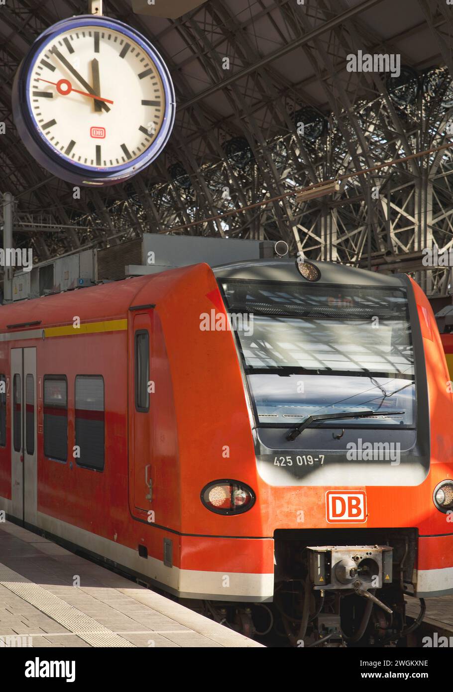Local trains at Frankfurt main station with station clock, Germany, Hesse, Frankfurt am Main Stock Photo