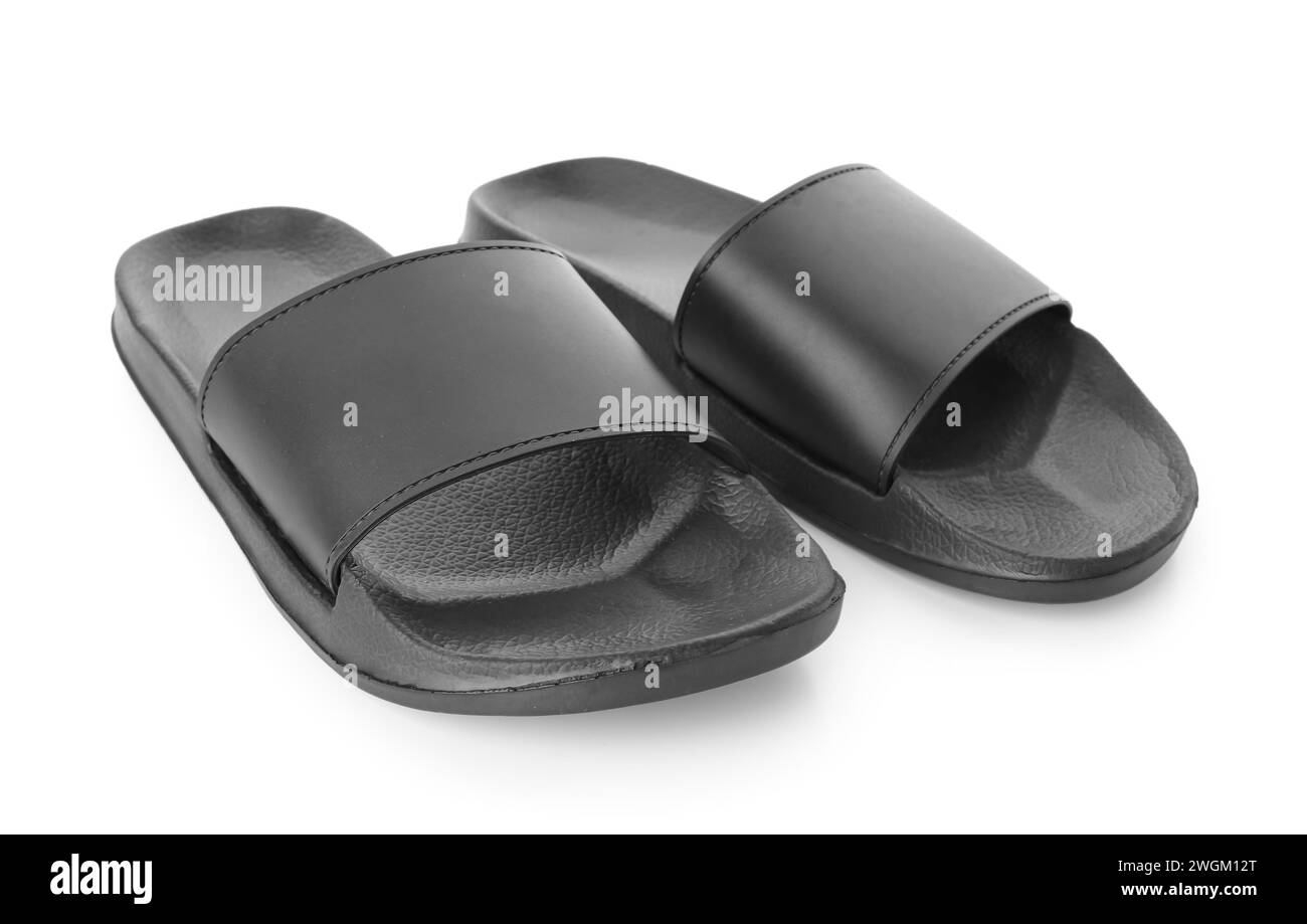 Black female flip flops on white background Stock Photo - Alamy