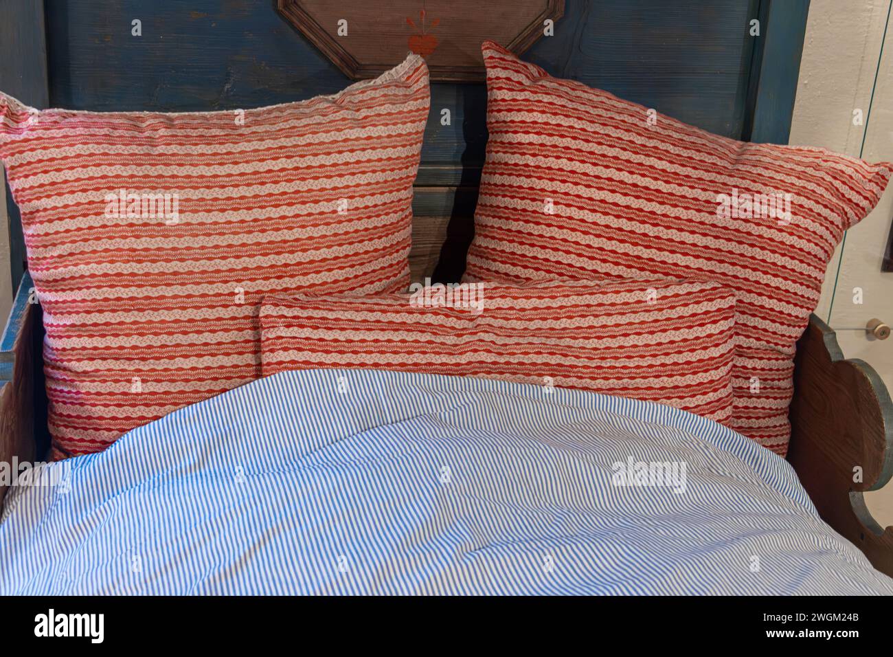 An old bed with pillows and featherbed Stock Photo Alamy