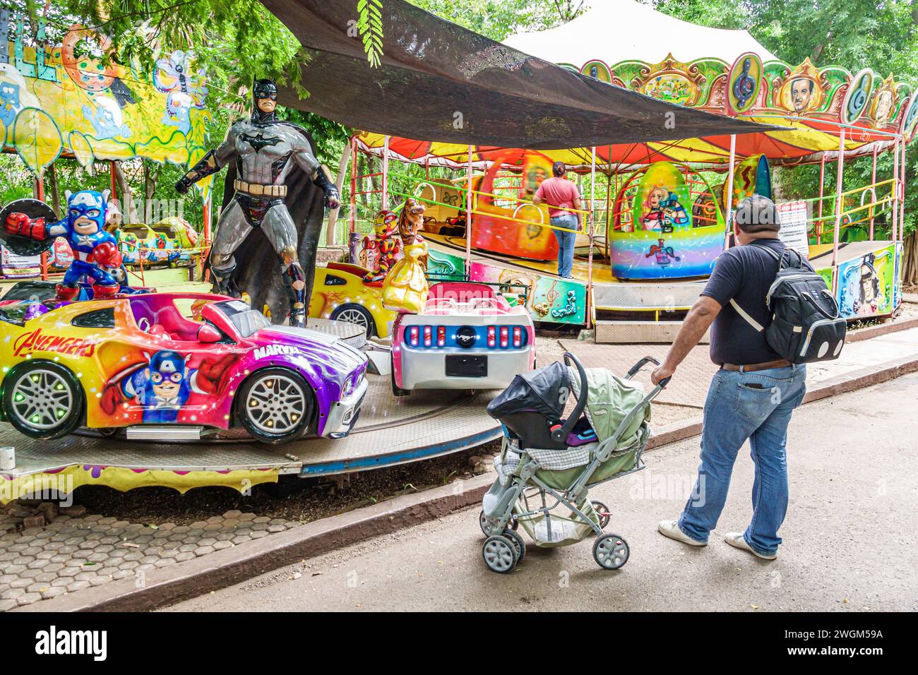 Merida Mexico,Parque Zoologico del Centenario centennial public park,amusement fantasy,carnival kiddie rides customized cars Batman statue,man men mal Stock Photo
