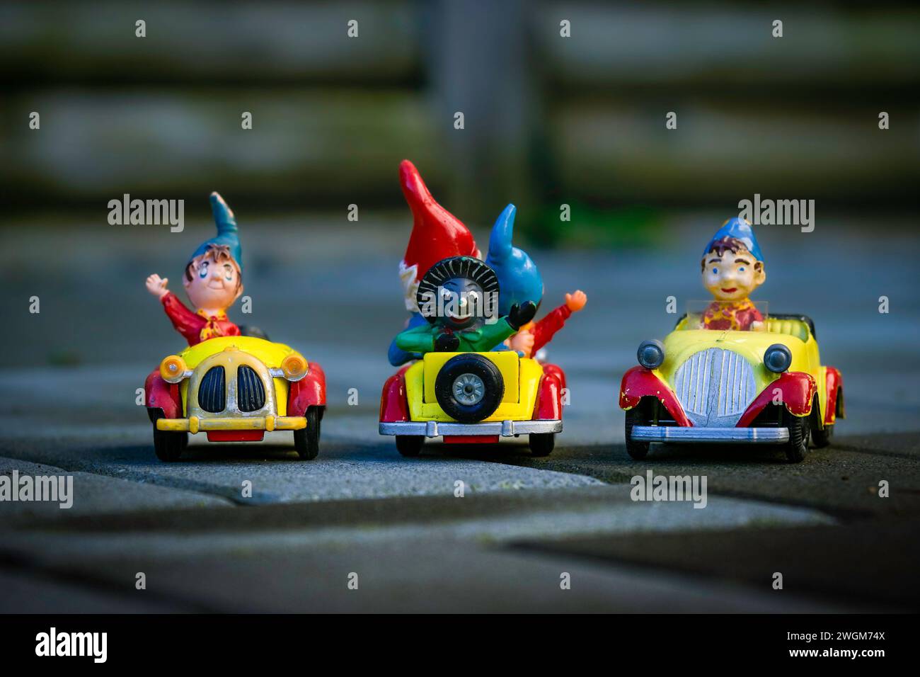 Different iterations of Noddy and his car one featuring Golly the Golliwog Stock Photo