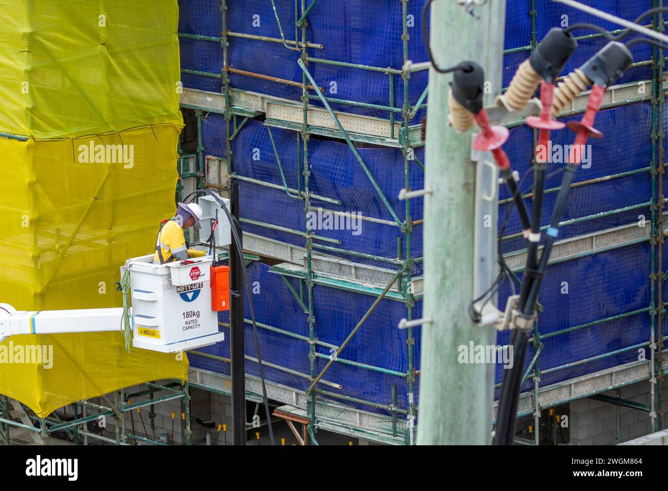 Lineman Working on power line infrastructure Stock Photo Alamy