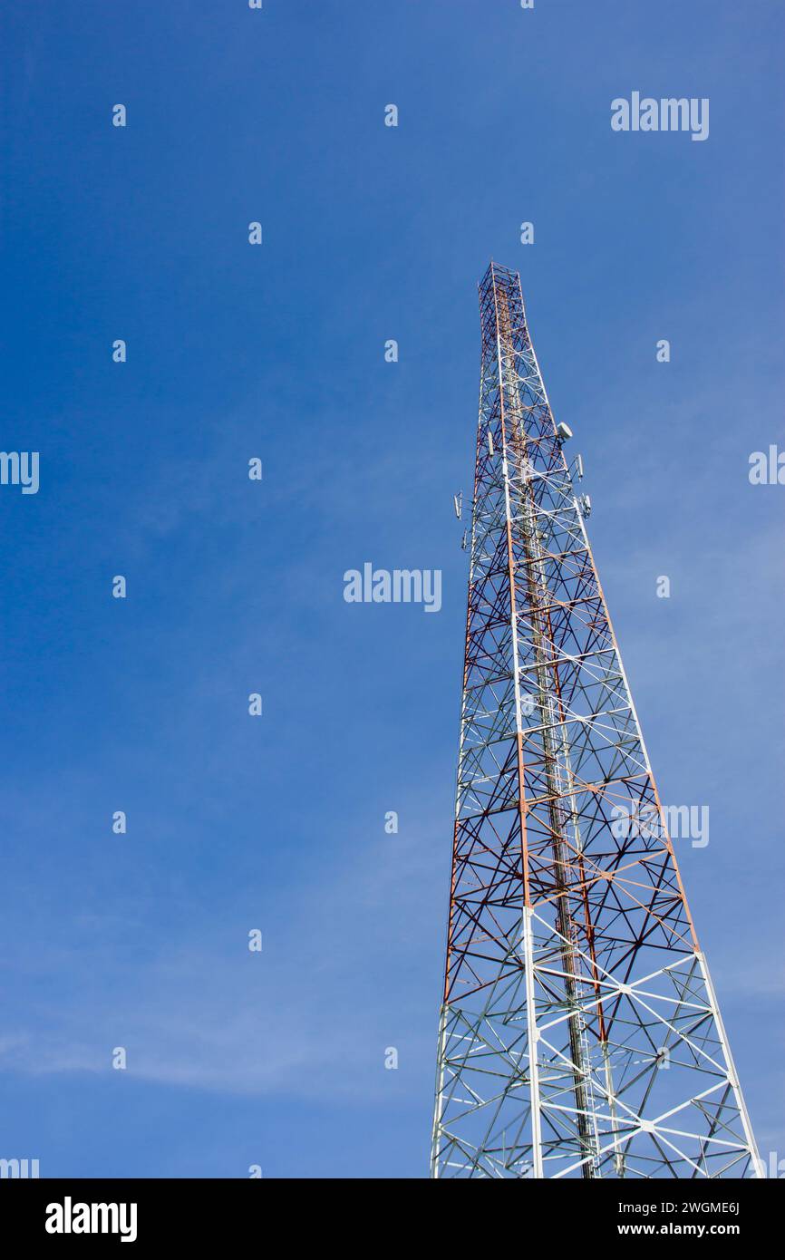 Photo of a high voltage power pole with a blue sky Stock Photo - Alamy