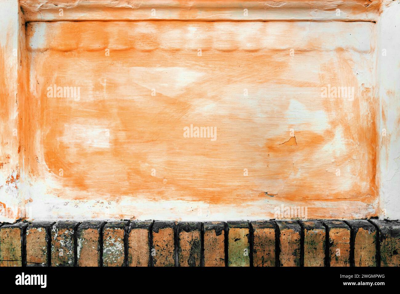 Grunge texture painted in peach fuzz, old wall surface as background and design element Stock Photo