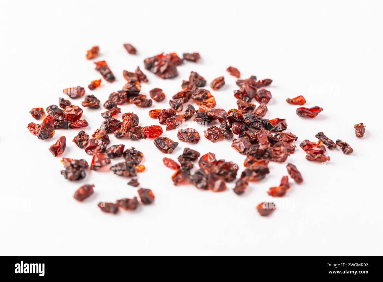 Pile of dried Berberis vulgaris, common barberry, European barberry or barberry. Edible herbal medicinal red fruit plant. Stock Photo