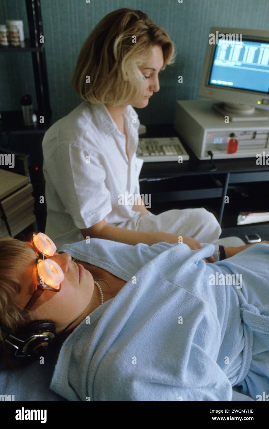 soft medecine brain waves synchronisation young woman depression alpha waves portrait with light sunglasses anti stress Stock Photo