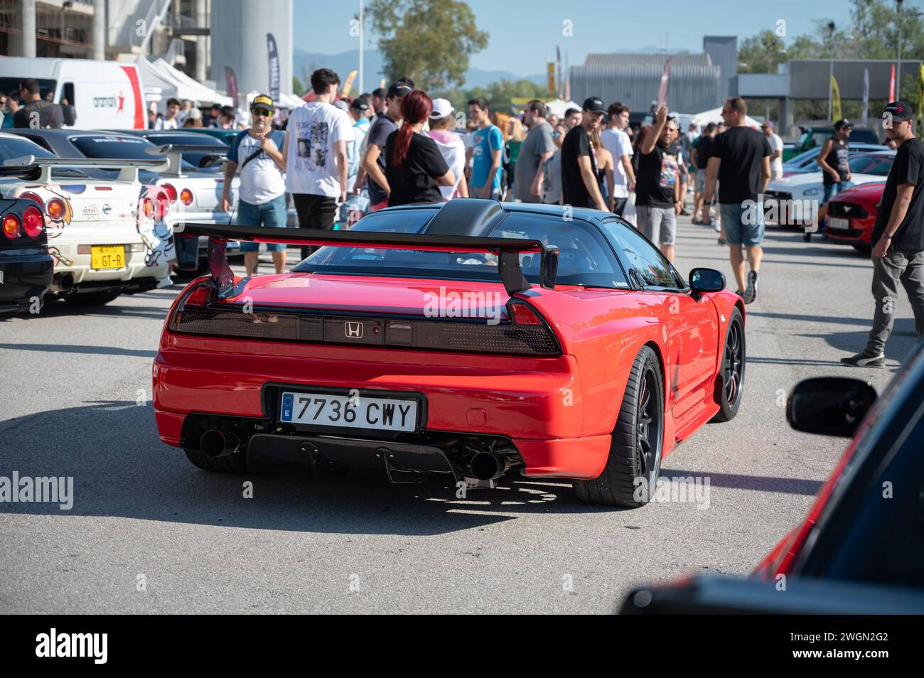 Rear view of a stunning mid-engine V6 Honda NSX. It is red with carbon fiber spoiler and rear diffuser Stock Photo