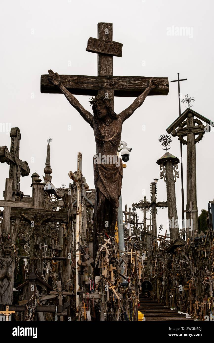 Each cross on Lithuania's Hill of Crosses represents a prayer, a hope, or a vow, creating a tapestry of faith and devotion. Stock Photo