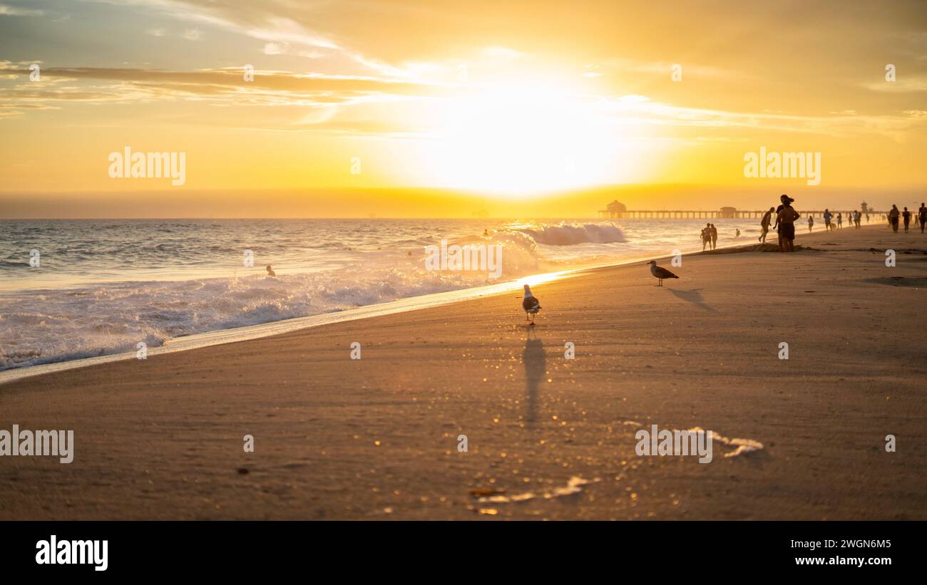 A stunning sunset with a picturesque sky over Huntington Beach, California Stock Photo