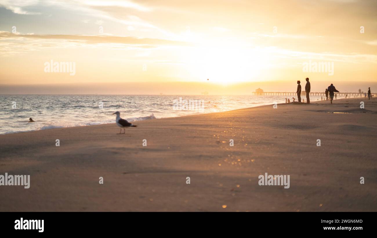 A stunning sunset with a picturesque sky over Huntington Beach, California Stock Photo