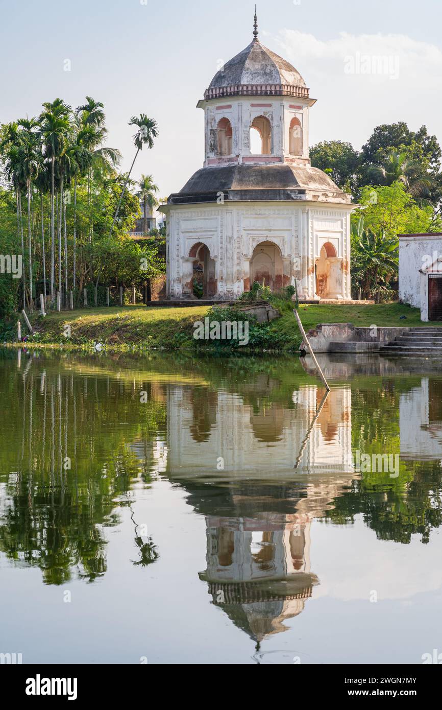 Vertical view of ancient octagonal Jagannath aka Roth temple with reflection in lake, Puthia, Rajshahi, Bangladesh Stock Photo