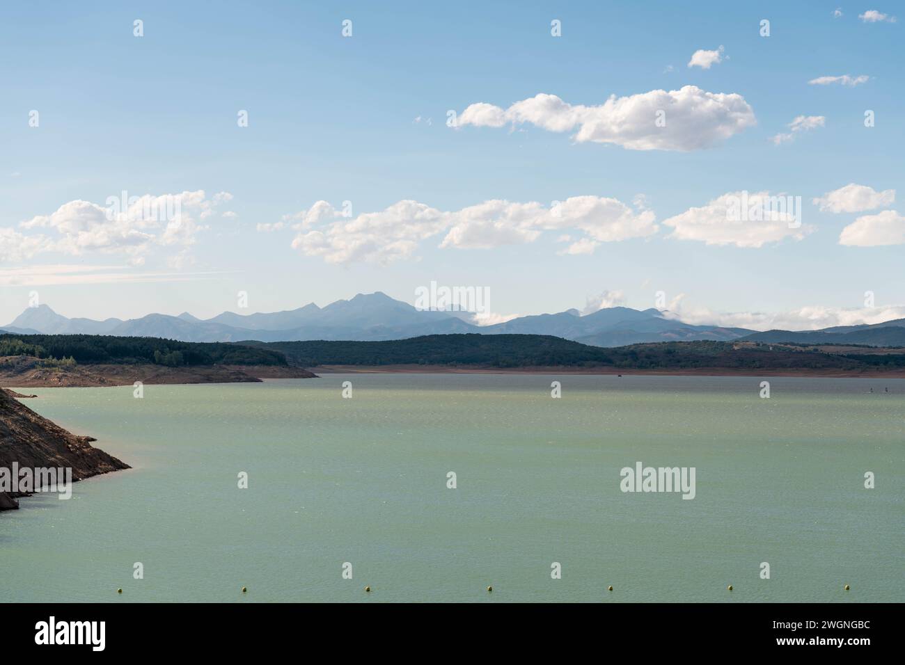 Green reservoir lake on a sunny day. Aguilar de Campoo, Spain Stock Photo