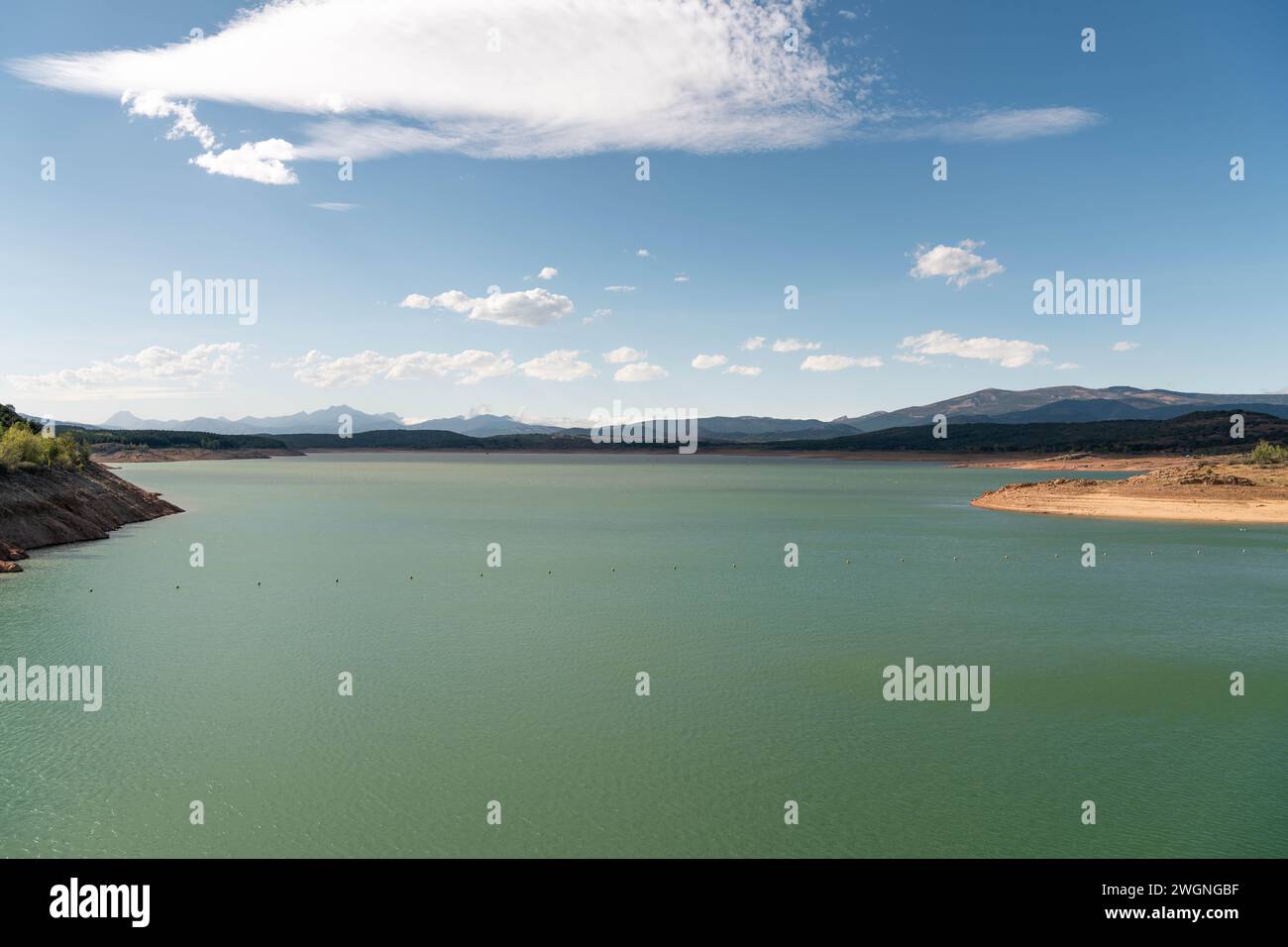 Green reservoir lake on a summer day. Aguilar de Campoo, Spain Stock Photo