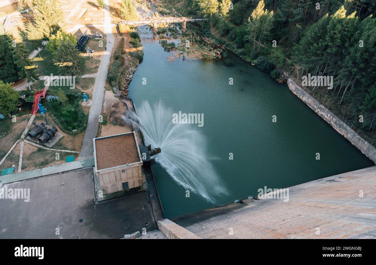 Hydroelectric dam releasing water. Aguilar de Campoo reservoir Stock Photo
