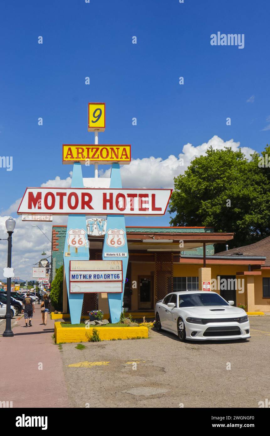 Vintage Route 66 Arizona motor hotel sign with a parked white car on a ...
