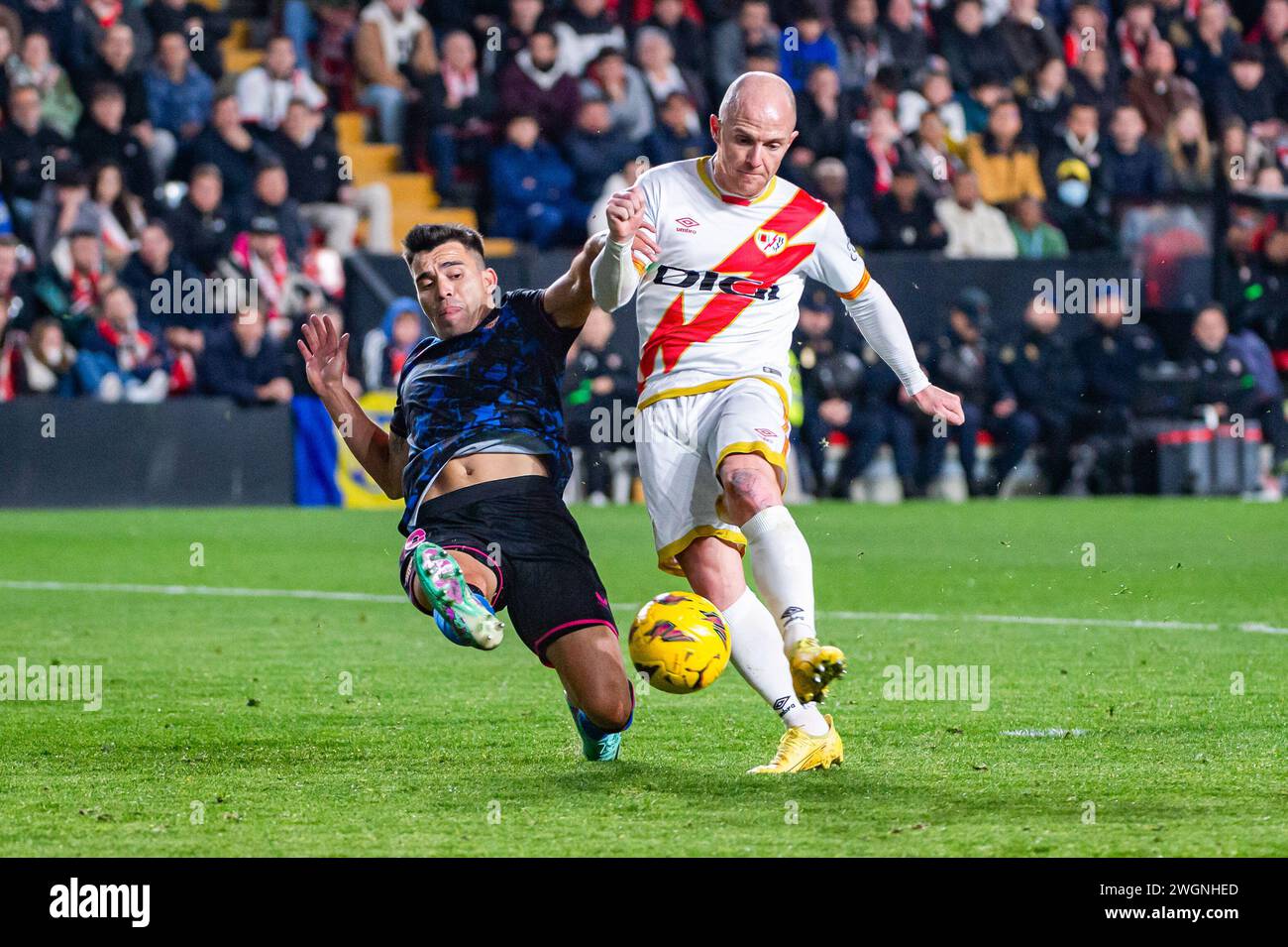 Madrid, Spain. 05th Feb, 2024. Isi Palazon (L) of Rayo Vallecano and Marcos Acuna (R) of Sevilla seen in action during the La Liga EA Sports 2023/24 football match between Rayo Vallecano vs Sevilla at Estadio Vallecas. Rayo Vallecano 1 : 2 Sevilla Credit: SOPA Images Limited/Alamy Live News Stock Photo