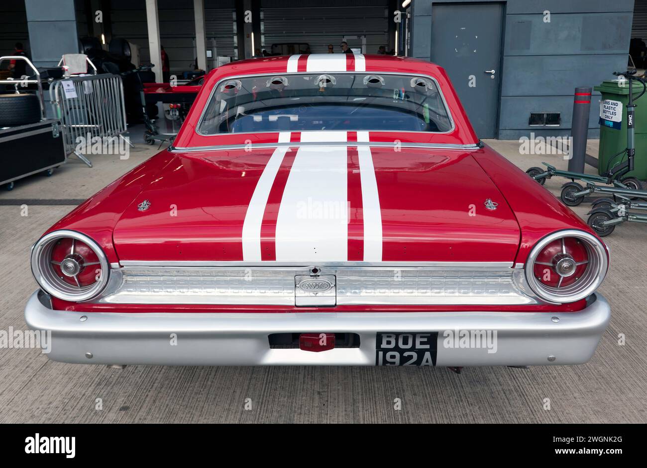 Rear View of Gregor Fisken and Christoff Cowens, Red and White, 1963, Ford Galaxie 500XL in the International Paddock at the 2023 Silverstone Festival Stock Photo