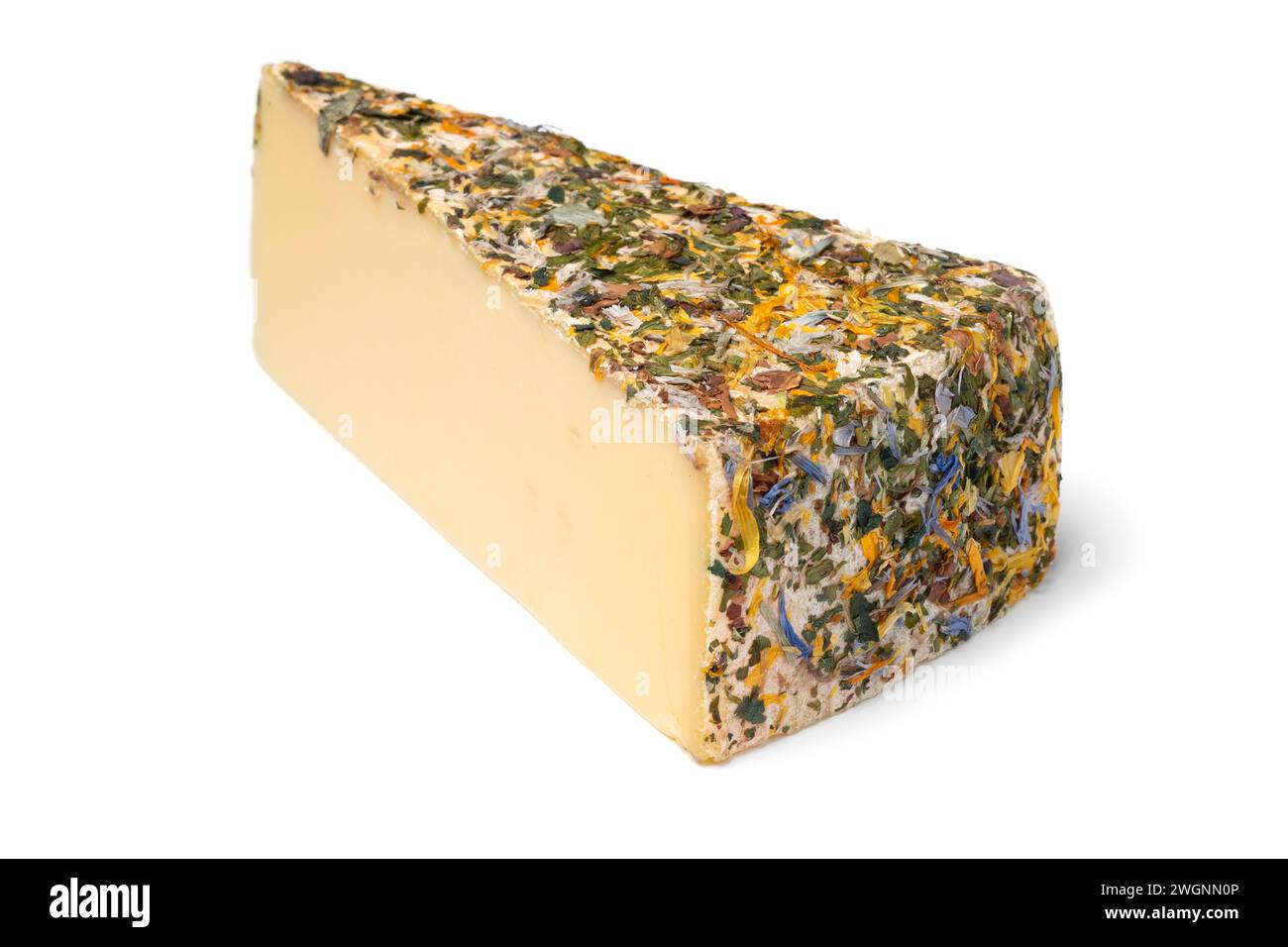 Piece of Tyroler hay flower cheese isolated on white background close