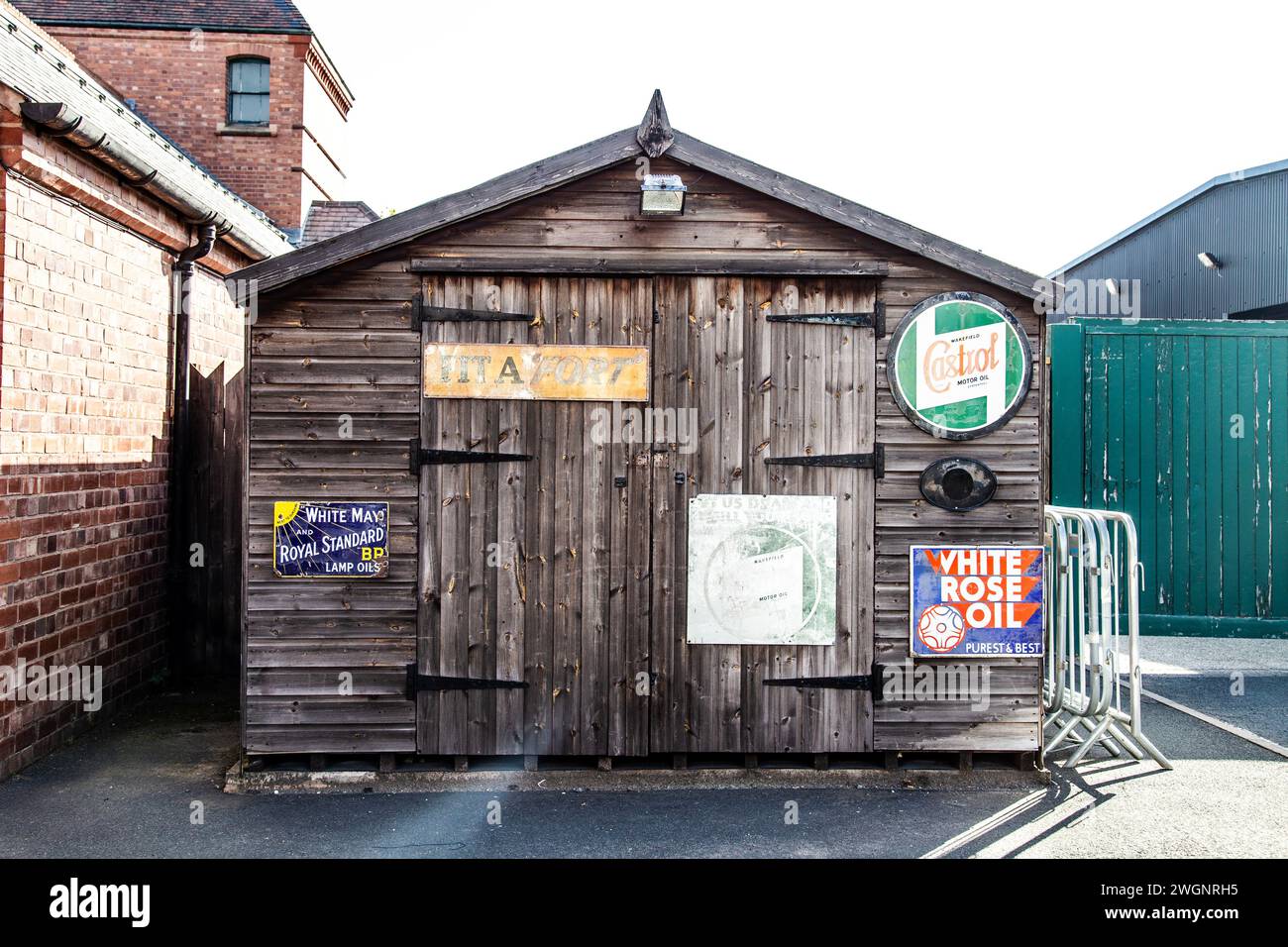 Wooden hut with retro automotive signs at the Black Country Living Museum, Dudley, England Stock Photo