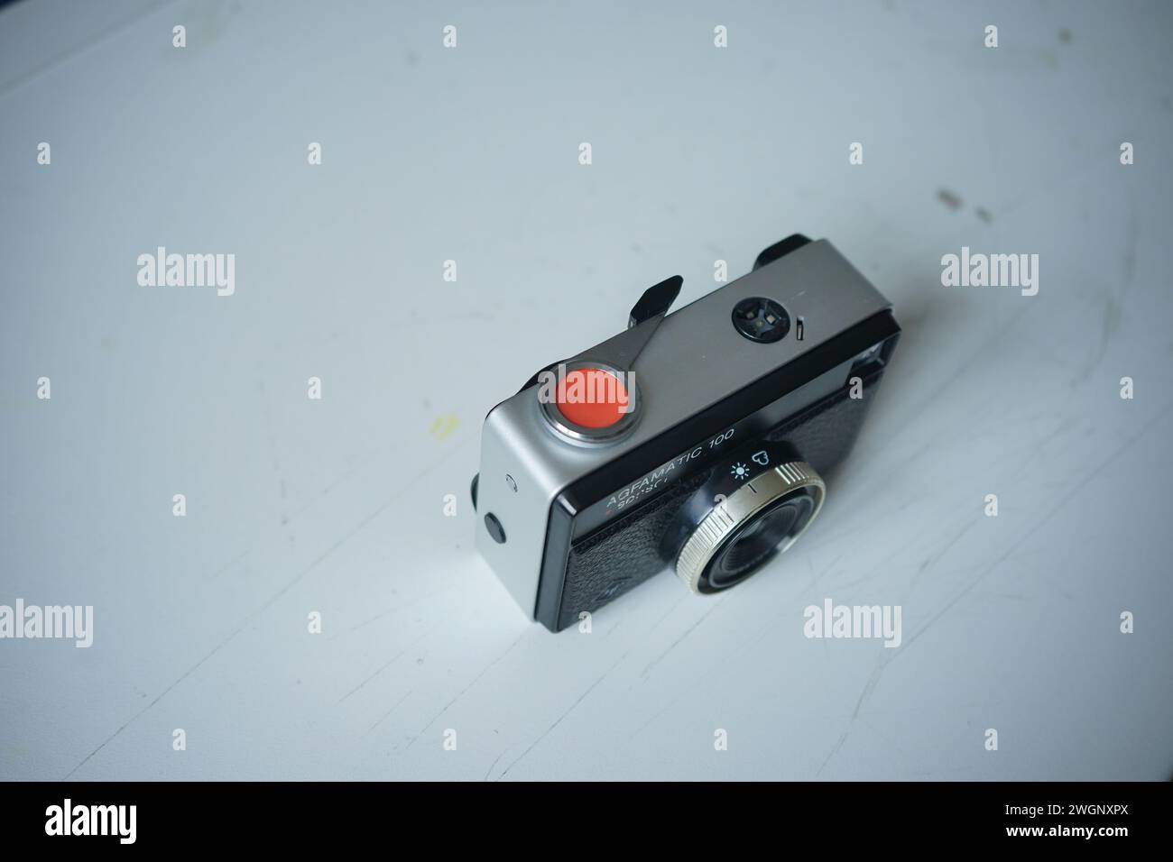 Agfamatic 100 sensor film photography camera on a white desk Stock Photo