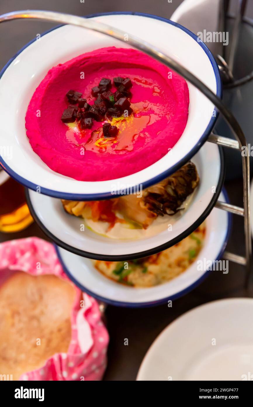 Three meze dishes served on rack Stock Photo