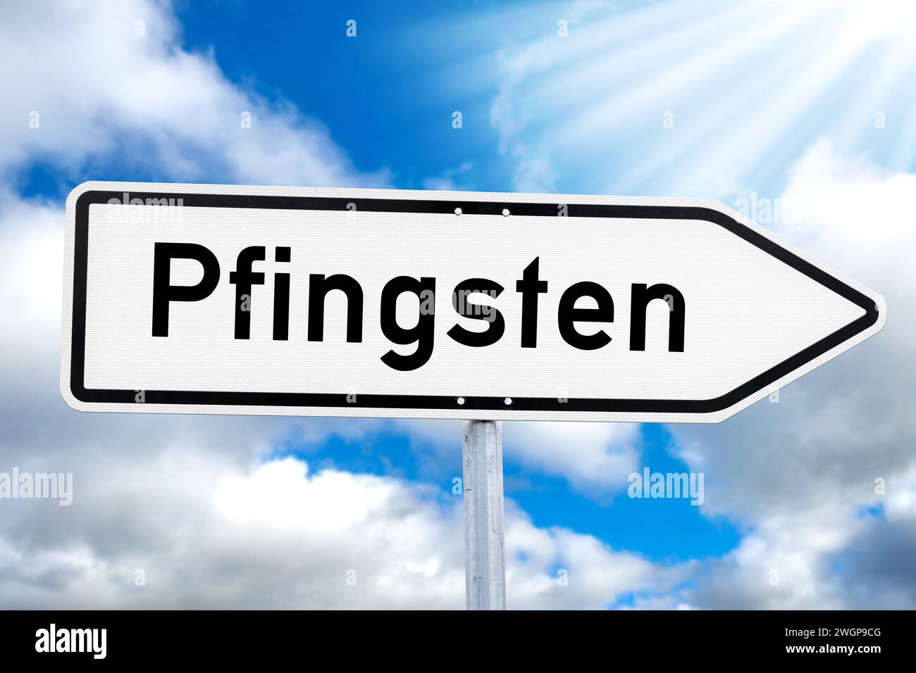 6 February 2024: Pentecost, inscription on a sign in front of a blue sky PHOTOMONTAGE *** Pfingsten, Aufschrift auf einem Schild vor blauem Himmel FOTOMONTAGE Stock Photo
