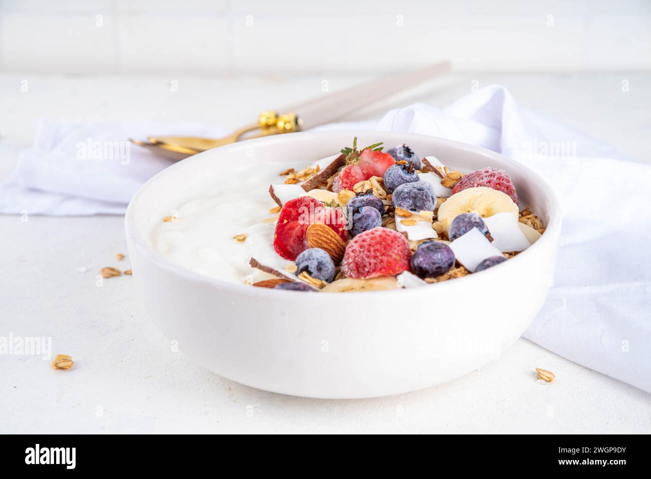 Delicious healthy balanced breakfast or lunch yogurt granola bowl with