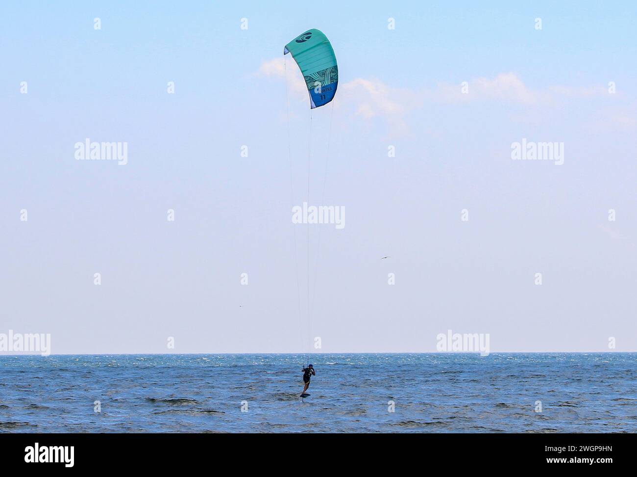 Gilgo Beach, New York, USA 13 August 2023 A man holding on to a