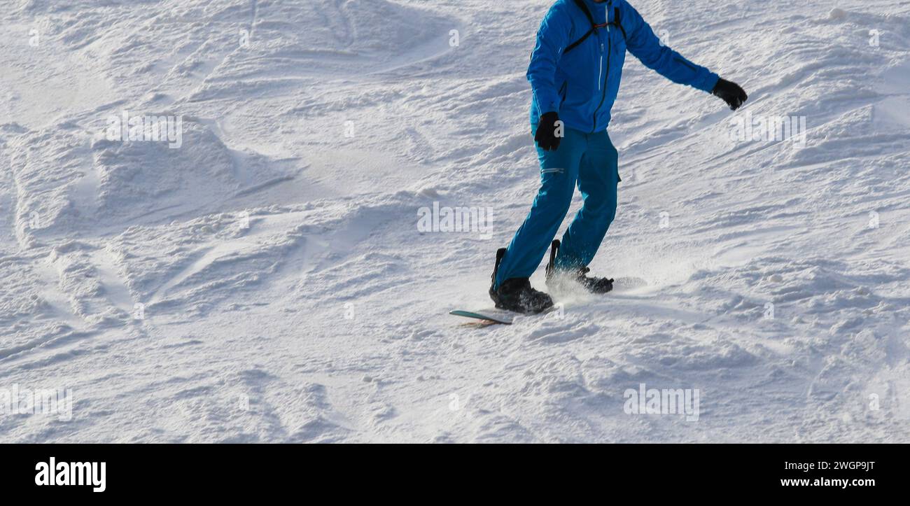 One man snowboarding on the mountain at Mt. Snow Vermont USA. Stock Photo