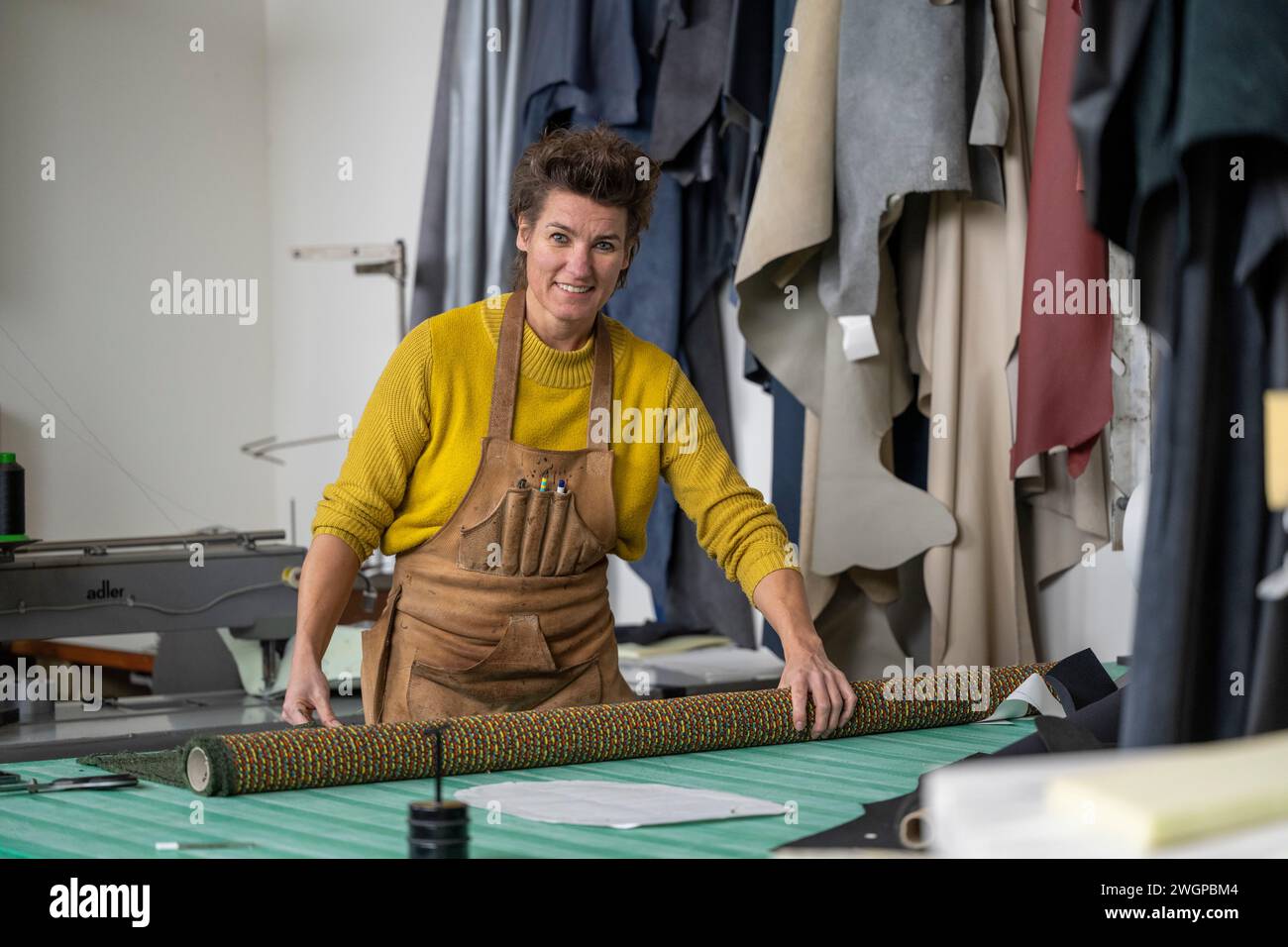 Female upholstery Portrait in her workshop Stock Photo