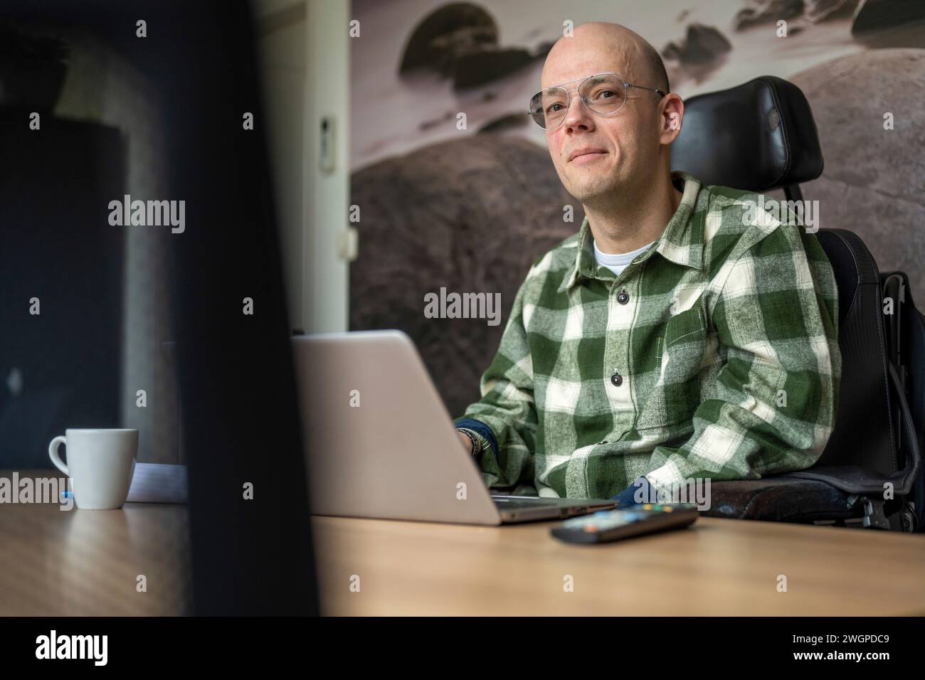 Portrait of Disabled businessman working on his computer. Stock Photo