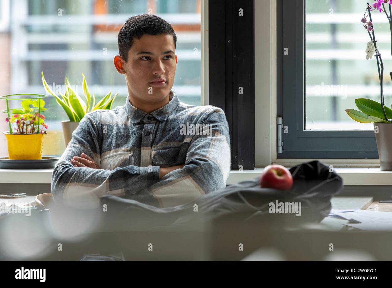 Mix nationality students in a european classroom studying Stock Photo