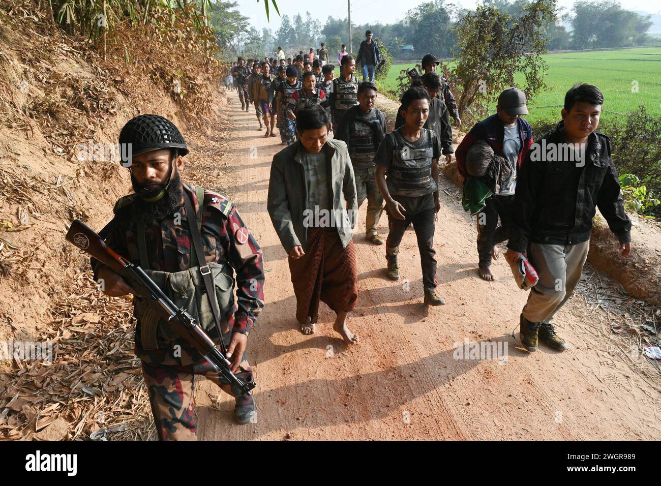Cox's Bazar district in Bangladesh. 6 Feb, 2024. Border Guard Bangladesh (BGB) personnel detain Myanmar's Border Guard Police (BGP) and security forces personnel seeking refuge in Bangladesh's Ukhia along the Bangladesh-Myanmar border, in Cox's Bazar district in Bangladesh, on February 6, 2024. At lest 264 members of Myanmar's border and security forces have come to Bangladesh to escape the fighting between the Myanmar army and the rebel Arakan Army at the border between the two countries, according to the Border Guard Bangladesh (BGB). Credit: Mamunur Rashid/Alamy Live News Stock Photo