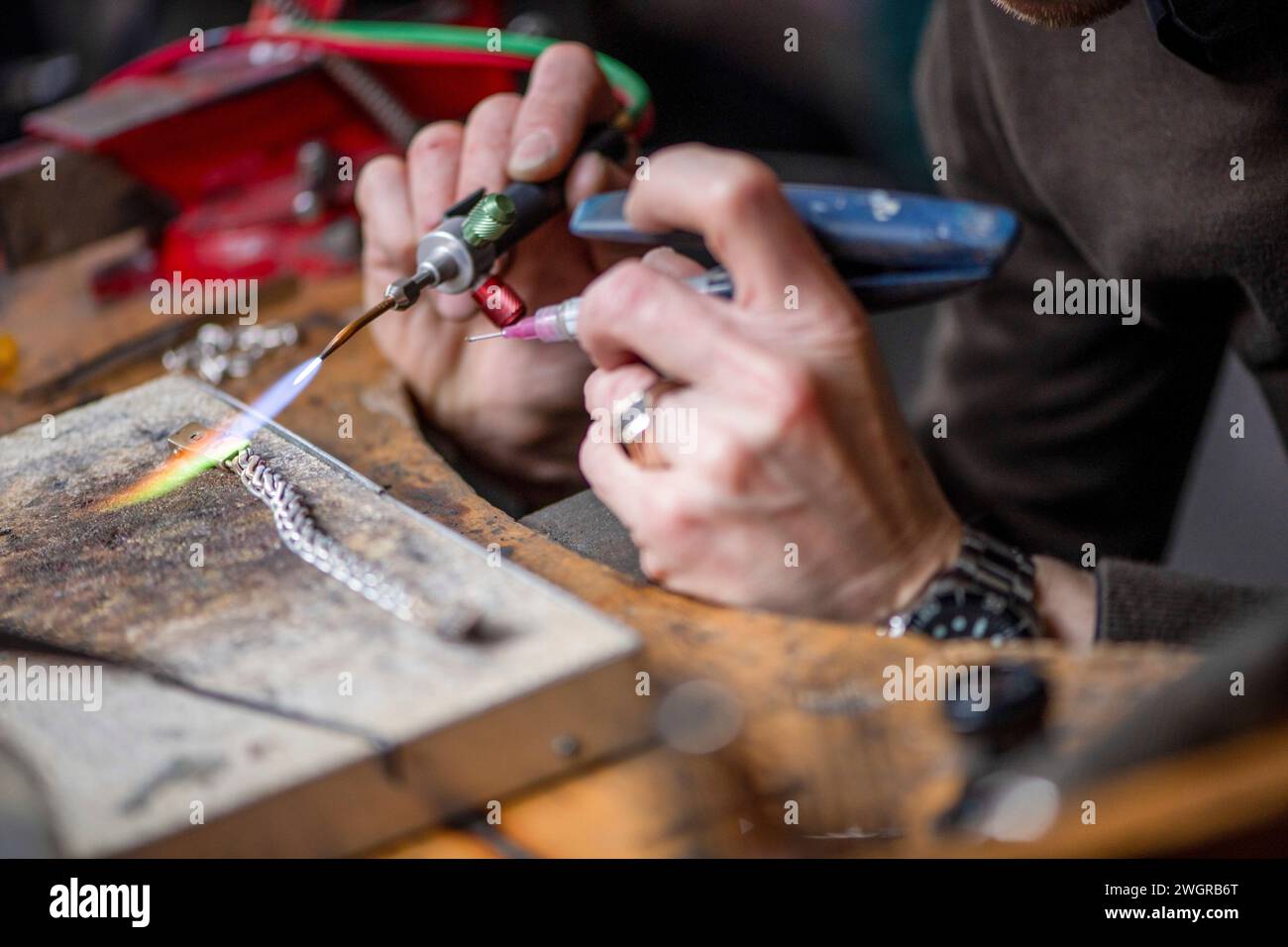 Jewelry repair from experience man with blow torch Stock Photo Alamy