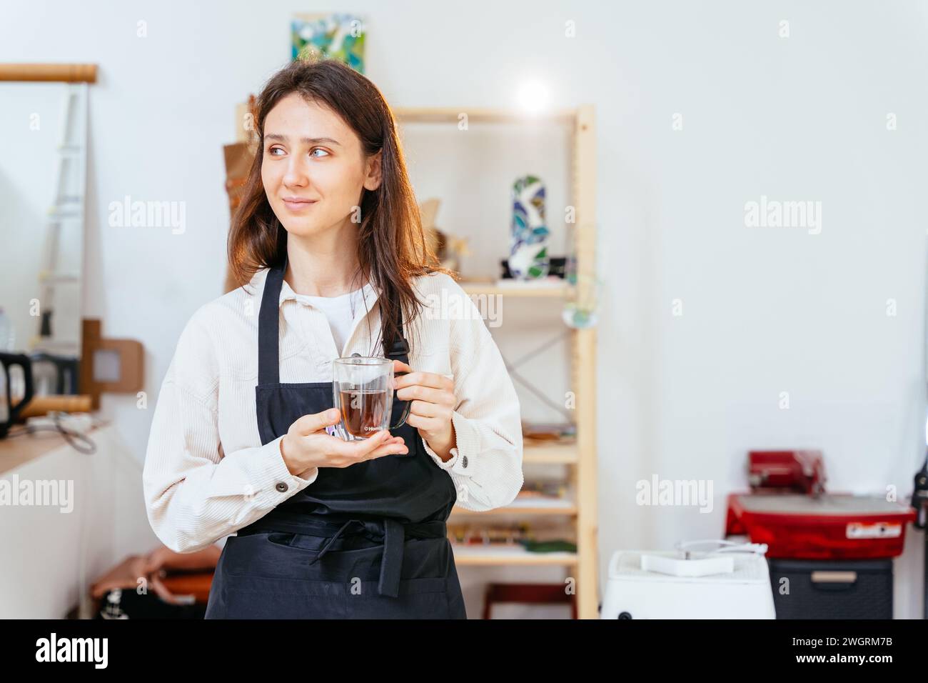 Portrait of positive female creator stained glass windows relaxing ...