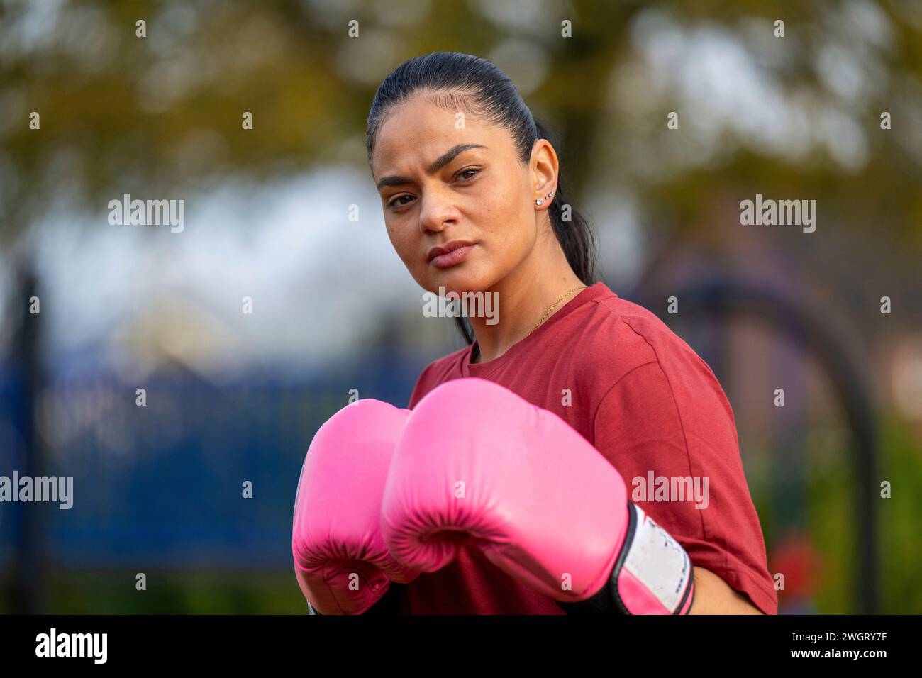 Healthy woman boxing training in a public park Stock Photo