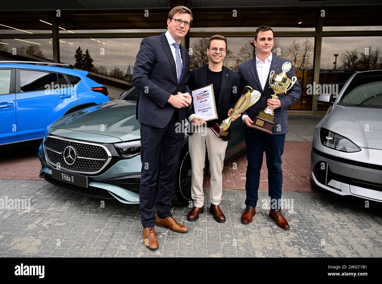 (L-R) Czech Traffic Minister Martin Kupka, Mercedes-Benz Czech Republic CEO Alexander Henzler and Mercedes-Benz Czech Republic external communications manager Josef Hlavka at the announcement of results of 30th annual Car of Year survey in Prague, Czech Republic, February 6, 2024. The title of Car of the Year 2024 in the Czech Republic was awarded to the Mercedes-Benz E-Class. In a vote by an expert jury of twenty motoring journalists, the new car beat the BMW 5 Series, which came second. Third place went to the Subaru Crosstrek. (CTK Photo/Roman Vondrous) Stock Photo