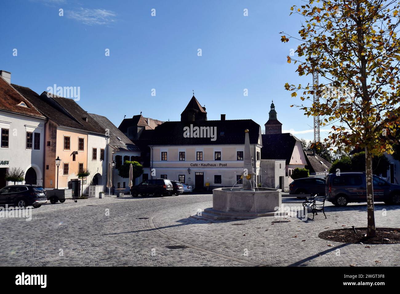 Stadtschlaining, Austria - November 07, 2023: The town's cobbled main square with buildings and fountain situated in south Burgenland Stock Photo