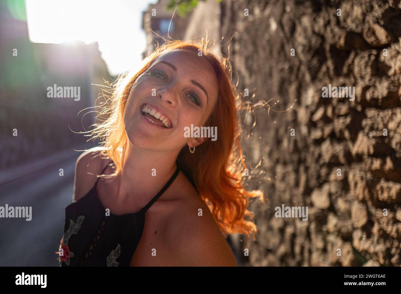 Young woman with red hair, laughing, Rome, Italy Stock Photo