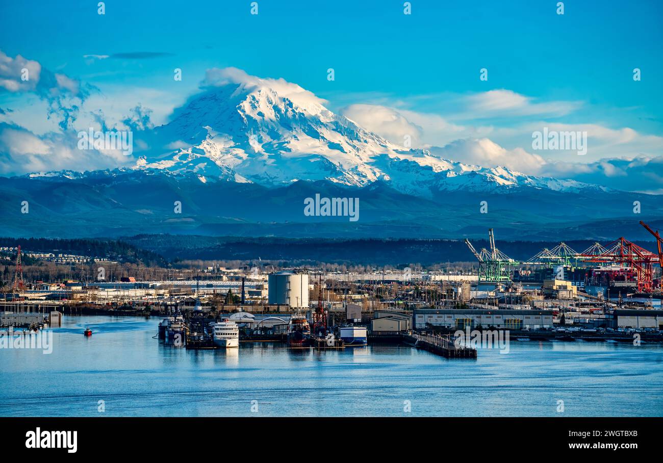 Mount Rainier towers over the Port of Tacoma in Washington State Stock ...