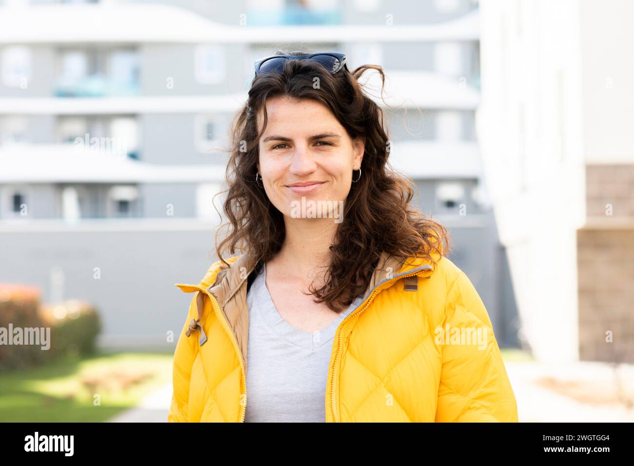 young woman standing outside Stock Photo
